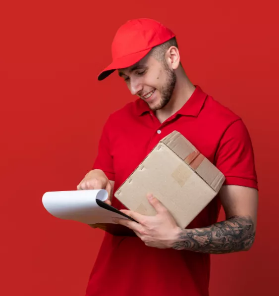 Mover holding a cardboard box and looking at his checklist